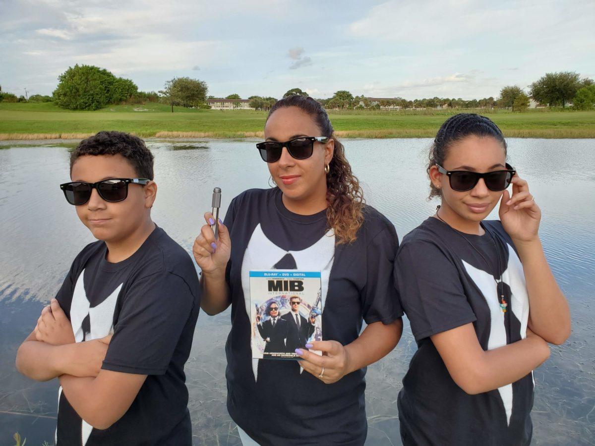 Family dressed as Men In Black Agents