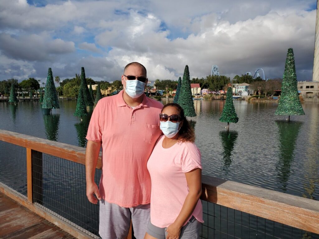 Couple in front of Christmas Trees at SeaWorld